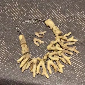 Bone necklace with matching earrings.
